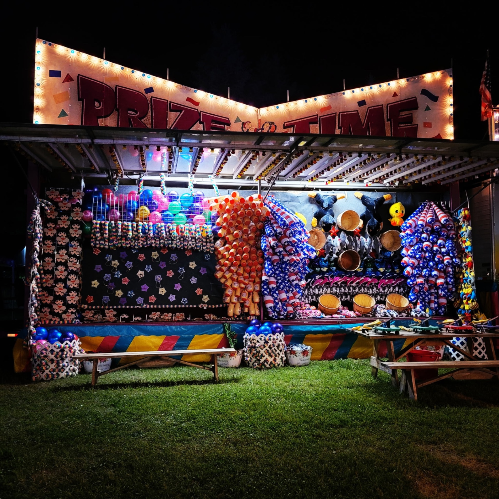 Tubs of Fun carnival game with rows of angled tubs ready for softball toss